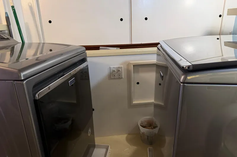 Slide: The Image of Bathroom with white towels on a rack in a 1997 Real Ships 61' Islander. - 26