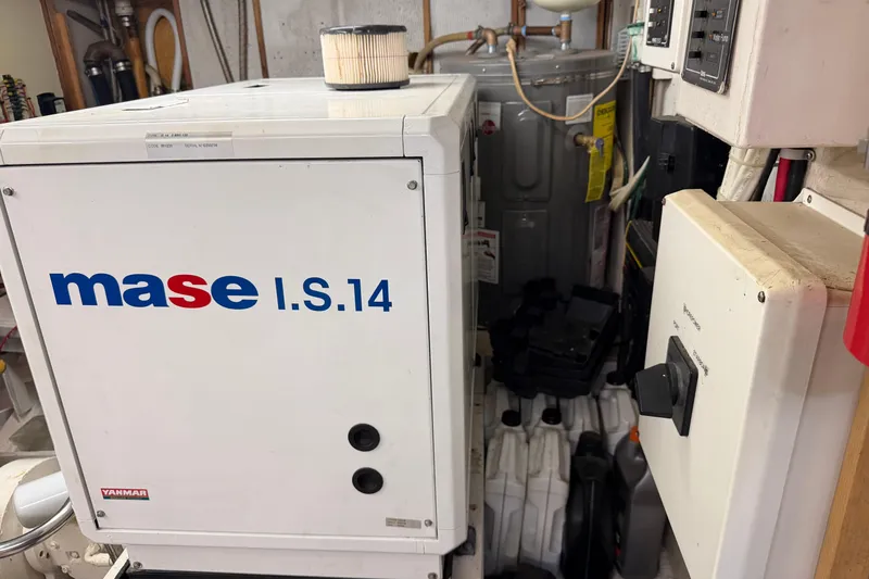 Slide: The Image of Laundry area on a 1997 Real Ships 61' Islander yacht with modern appliances. - 28