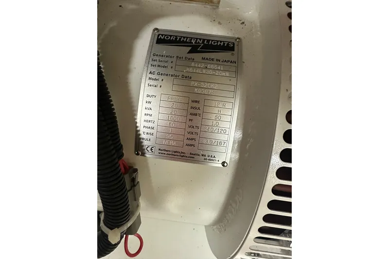 Slide: The Image of Engine room of 1997 Real Ships 61' Islander with generator and tool storage. - 31