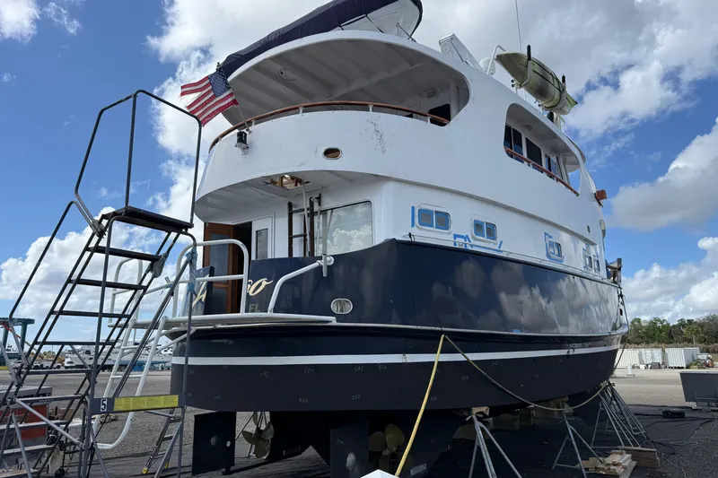 Slide: The Image of Luxurious interior of 1997 Real Ships 61' Islander yacht with elegant seating and dining area. - 4