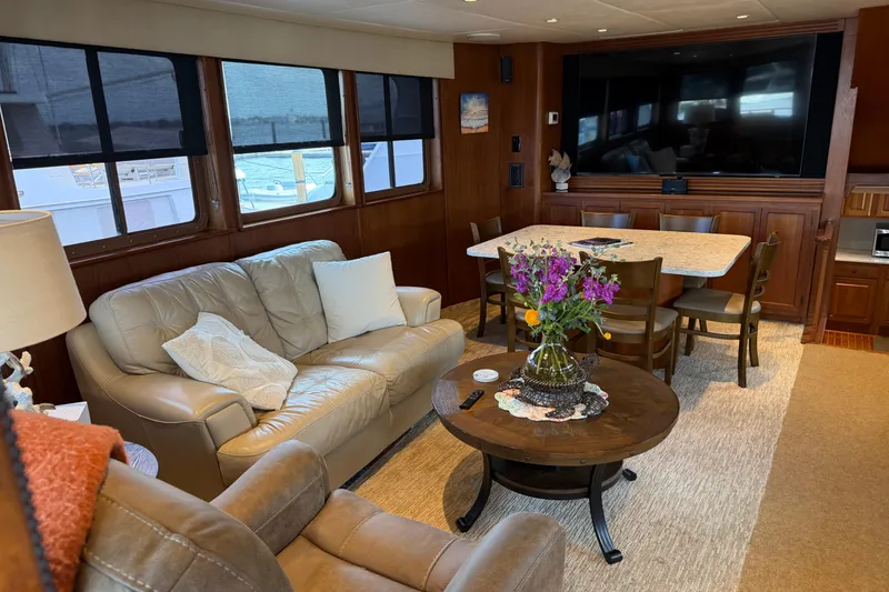 Slide: The Image of Luxurious interior of 1997 Real Ships 61' Islander yacht with cozy seating and decor. - 6