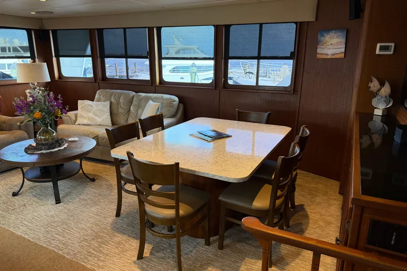 Slide: The Image of Helm of 1997 Real Ships 61' Islander with Garmin navigation displays and wooden steering wheel. - 9