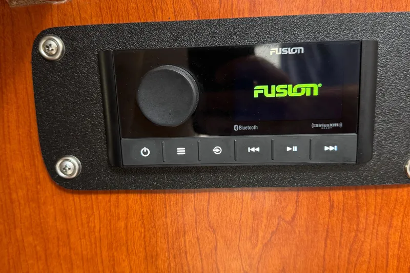Slide: The Image of Fusion audio system on 2005 Boston Whaler 305 Conquest boat dashboard. - 35