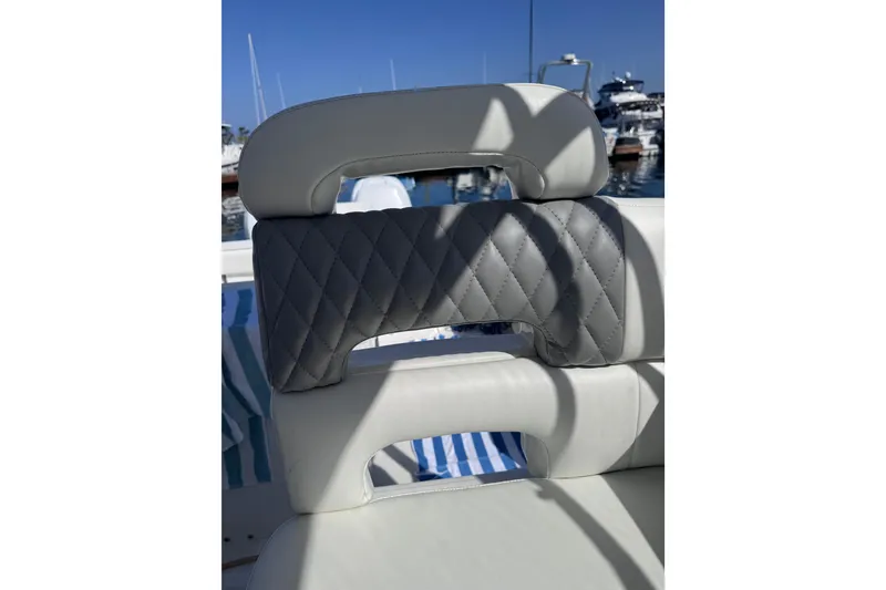 Slide: The Image of Luxury seating on a 2005 Boston Whaler 305 Conquest boat, featuring quilted upholstery. - 41