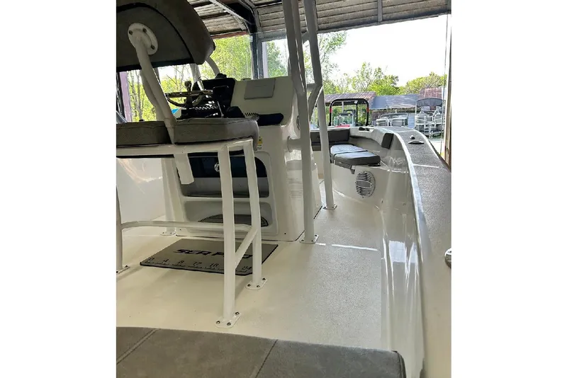 Slide: The Image of 2023 Sea Pro 199 Deep V Center Console interior with seating and steering console. - 10