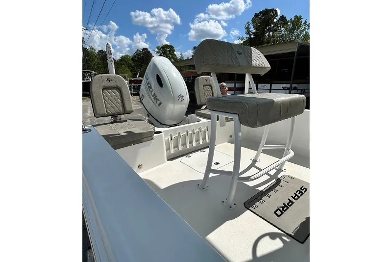 Slide: The Image of 2023 Sea Pro 199 Deep V Center Console boat interior with Suzuki engine. - 5