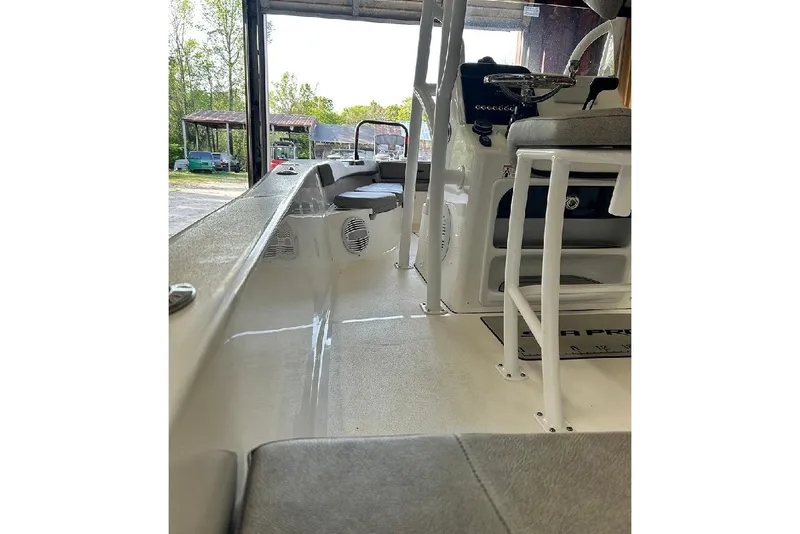Slide: The Image of 2023 Sea Pro 199 Deep V Center Console interior view, showcasing seating and console area. - 9