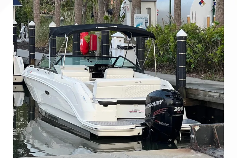 The Image of 2019 Sea Ray SDX 250 Outboard boat docked, featuring a Mercury 300 engine. - 0