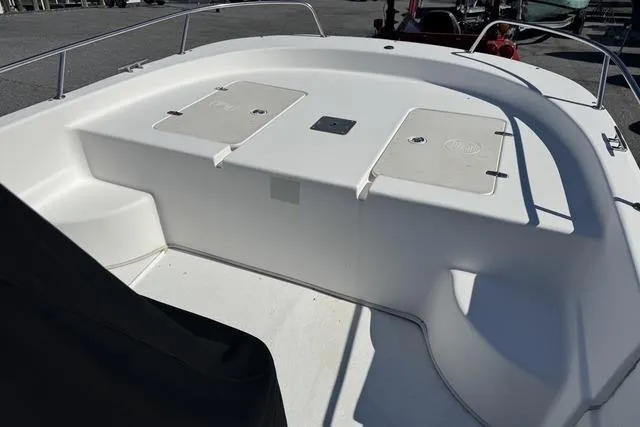 Slide: The Image of 2011 Carolina Skiff 218 DLV boat deck with storage compartments. - 12