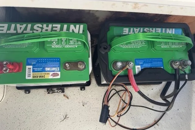 Slide: The Image of Two Interstate batteries in a 2011 Carolina Skiff 218 DLV boat. - 9
