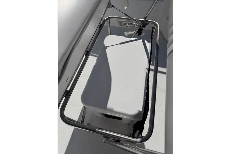 Slide: The Image of White cooler on a 2011 Carolina Skiff 218 DLV boat deck. - 15