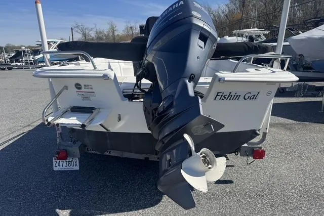 Slide: The Image of 2011 Carolina Skiff 218 DLV boat with Yamaha outboard motor, named "Fishin Gal." - 2