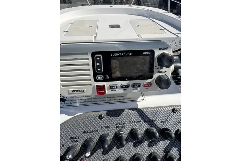 Slide: The Image of 2011 Carolina Skiff 218 DLV boat dashboard with Uniden UM415 marine radio. - 4