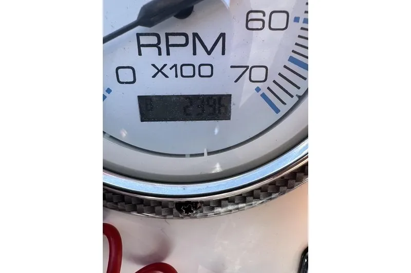 Slide: The Image of Close-up of a 2011 Carolina Skiff 218 DLV RPM gauge displaying 2390 RPM. - 6