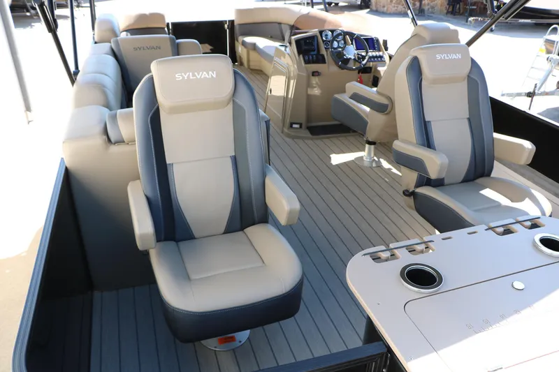 Slide: The Image of 2026 Sylvan Mirage X3 Party Fish boat interior with luxurious seating and modern dashboard. - 22