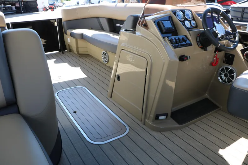 Slide: The Image of 2026 Sylvan Mirage X3 Party Fish boat interior with modern dashboard and seating. - 29