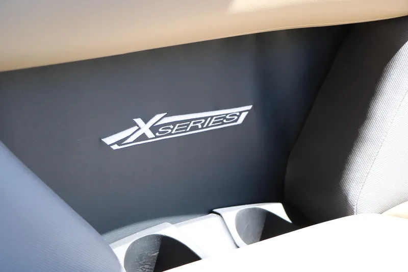 Slide: The Image of 2026 Sylvan Mirage X3 Party Fish interior with "X Series" branding detail. - 36