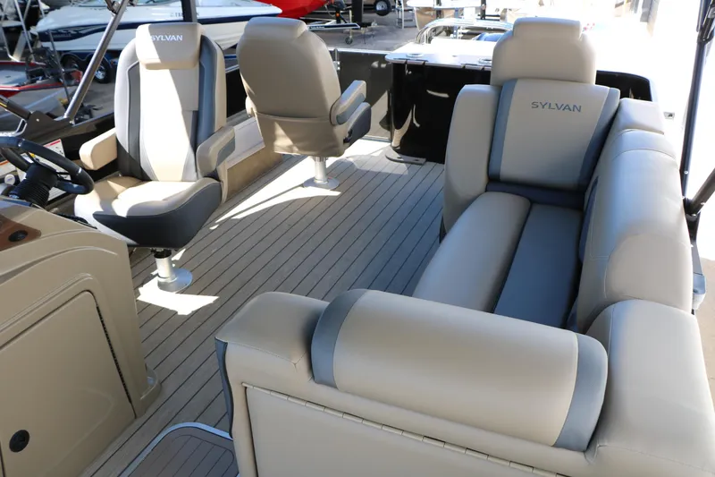 Slide: The Image of 2026 Sylvan Mirage X3 Party Fish boat interior with plush seating and modern design. - 37