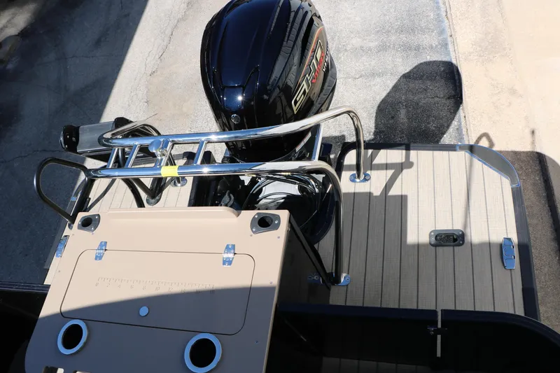 Slide: The Image of 2026 Sylvan Mirage X3 Party Fish boat with outboard motor and deck view. - 38