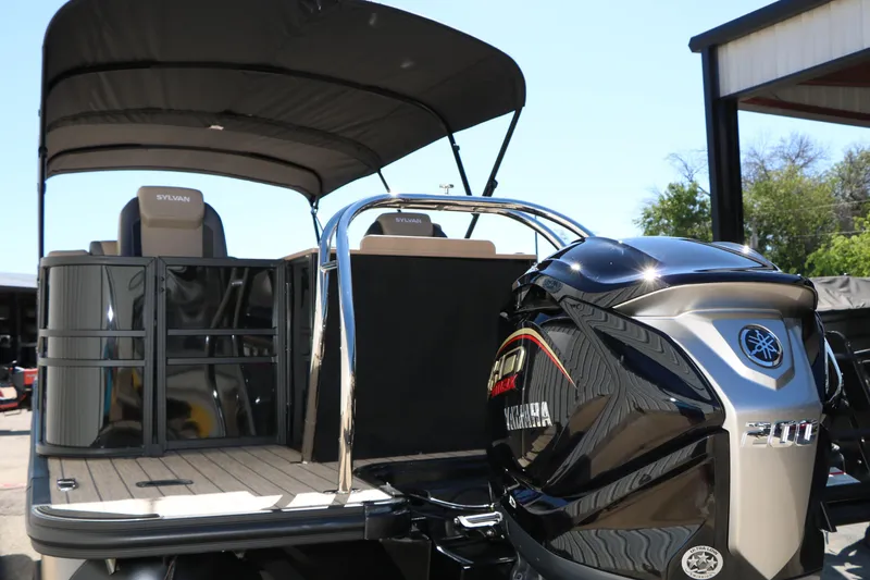 Slide: The Image of 2026 Sylvan Mirage X3 Party Fish pontoon boat with Yamaha outboard motor. - 7