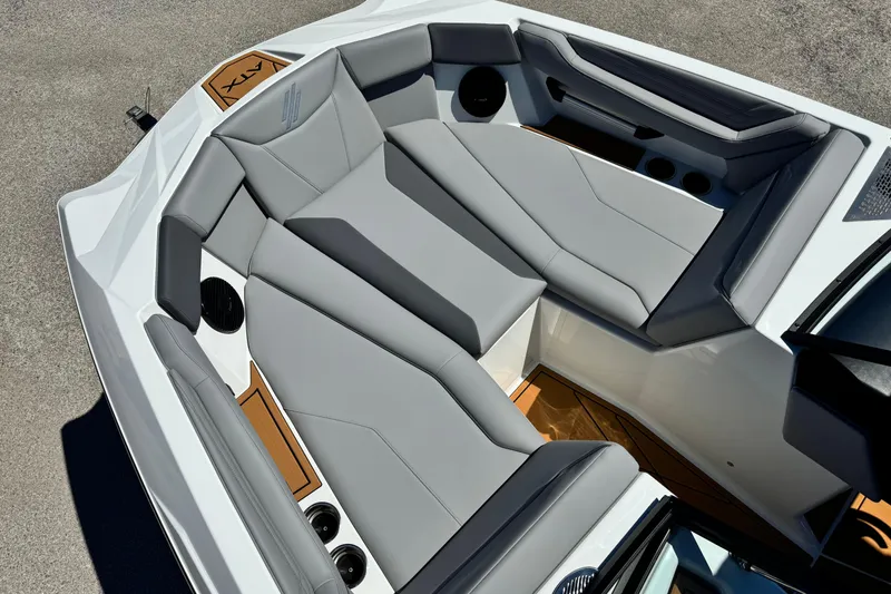 Slide: The Image of 2026 ATX Surf Boats 22 Type-S interior with gray seating and cup holders. - 10