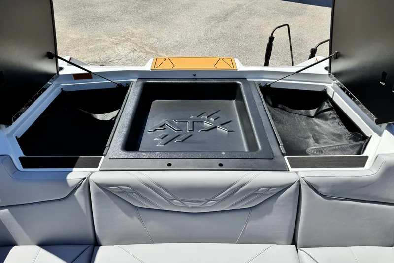 Slide: The Image of 2026 ATX Surf Boats 22 Type-S interior storage compartments with sleek design and logo. - 13