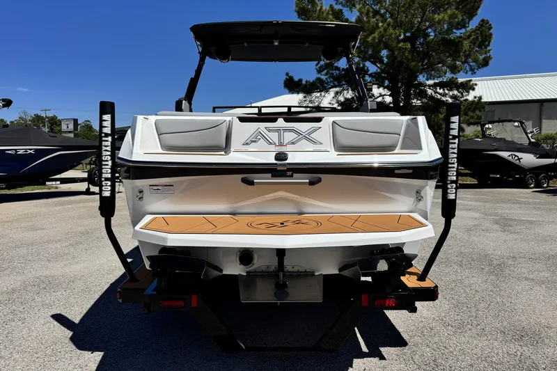 Slide: The Image of 2026 ATX Surf Boats 22 Type-S, rear view, parked outdoors on a sunny day. - 3