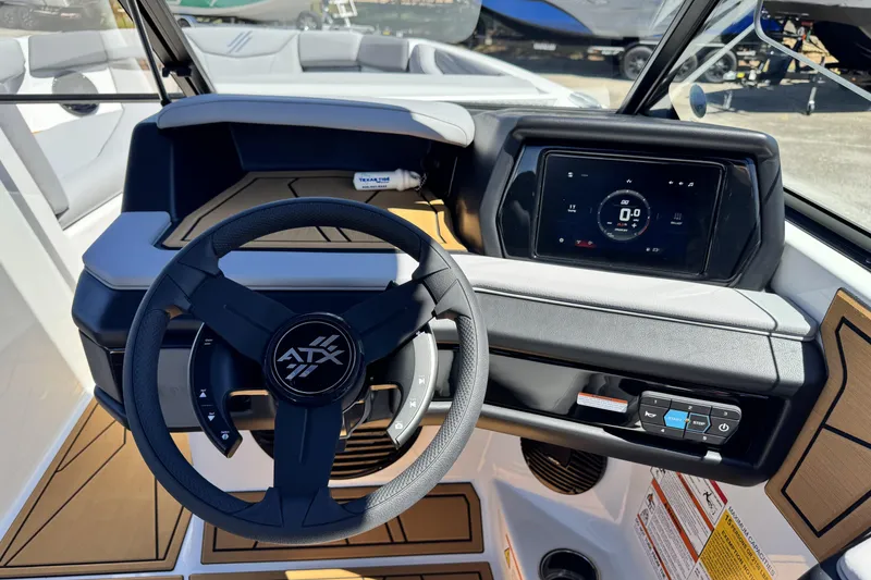 Slide: The Image of 2026 ATX Surf Boats 22 Type-S dashboard with steering wheel and digital display. - 8