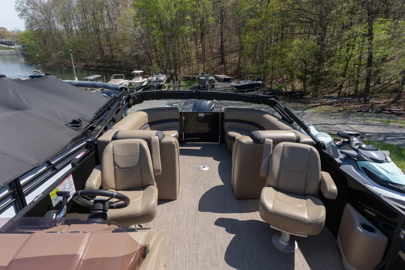 Slide: The Image of Luxurious 2025 Starcraft EXS 3 boat interior with plush seating and scenic lake view. - 11