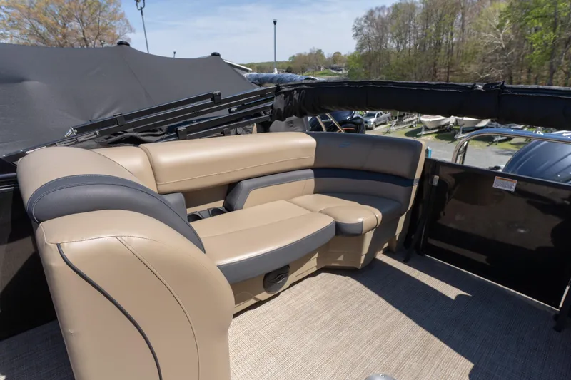 Slide: The Image of Luxurious seating on 2025 Starcraft EXS 3 boat, featuring beige and black upholstery. - 13