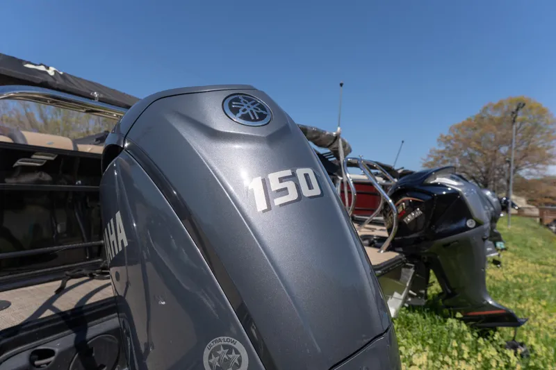 Slide: The Image of Yamaha 150 outboard motor on 2025 Starcraft EXS 3 boat, sunny day background. - 14