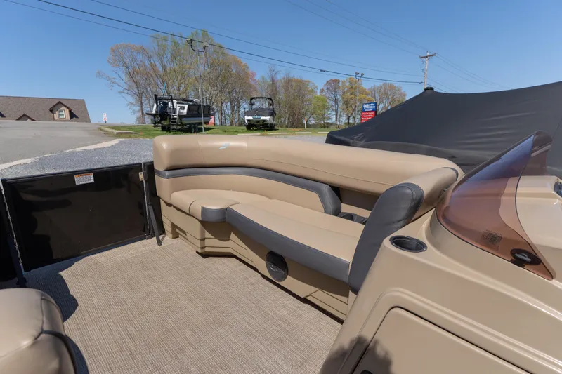 Slide: The Image of 2025 Starcraft EXS 3 boat interior with beige seating and outdoor setting. - 4