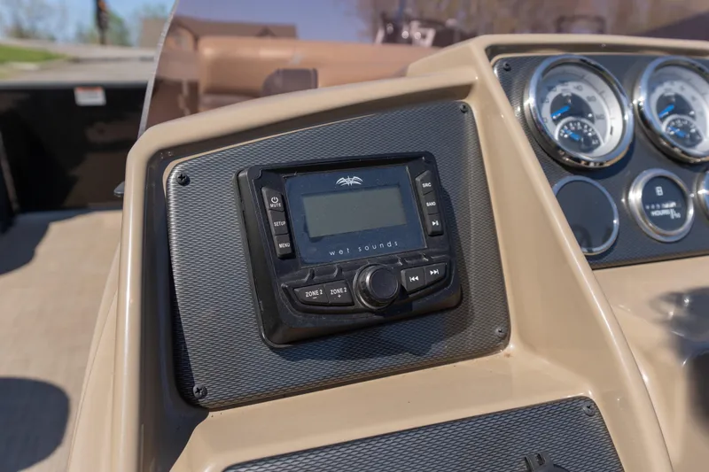 Slide: The Image of Dashboard of 2025 Starcraft EXS 3 boat with control panel and gauges. - 7