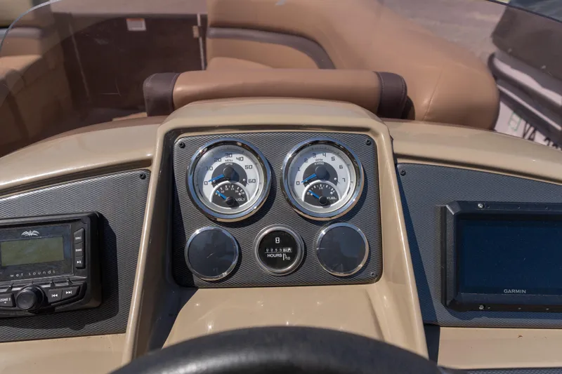 Slide: The Image of Dashboard of 2025 Starcraft EXS 3 boat with gauges and controls. - 8