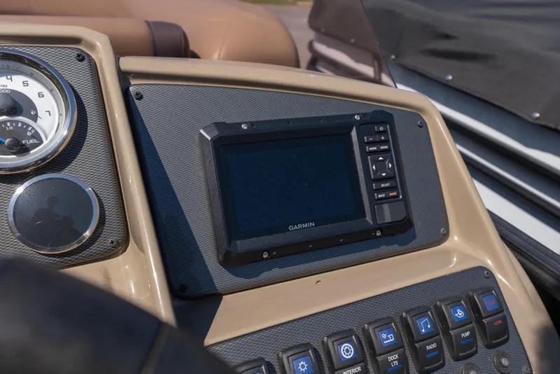 Slide: The Image of Dashboard of 2025 Starcraft EXS 3 boat with Garmin display and controls. - 9