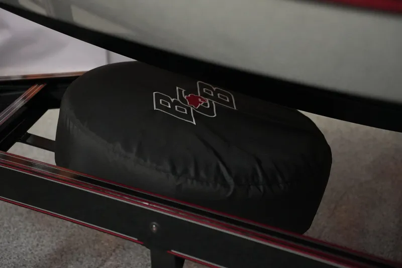 Slide: The Image of 2026 Bass Cat Lynx STS trailer with branded tire cover, showcasing logo detail. - 10