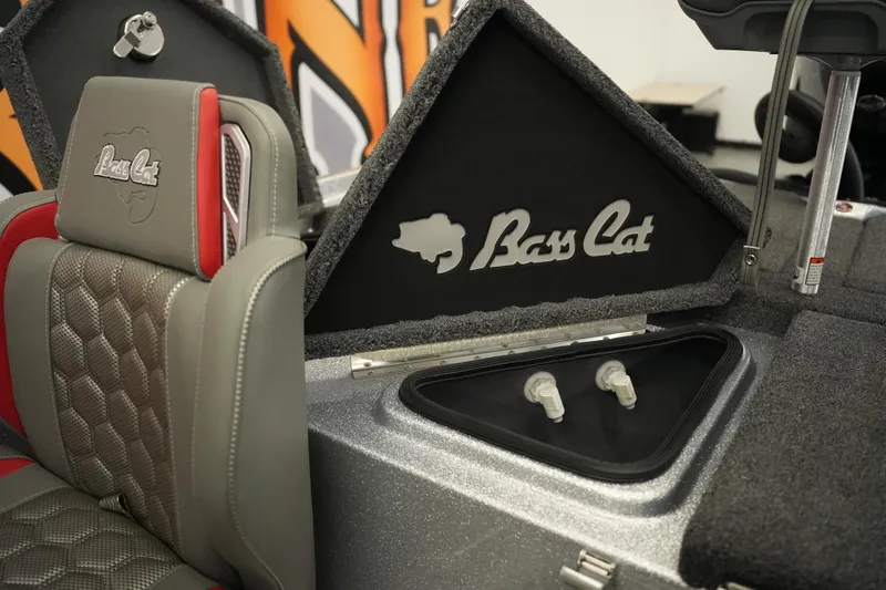 Slide: The Image of 2026 Bass Cat Lynx STS boat interior with logo and seating detail. - 21