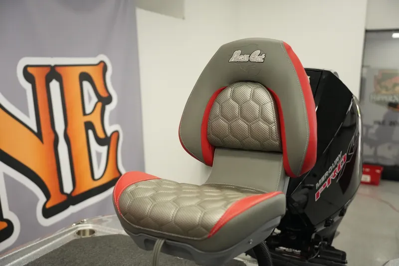 Slide: The Image of 2026 Bass Cat Lynx STS boat seat with red accents and textured upholstery. - 26