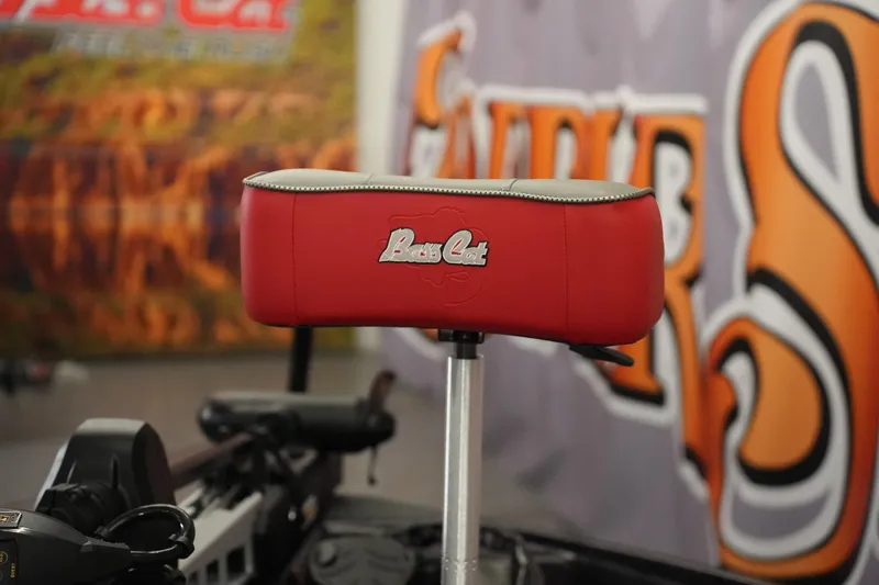 Slide: The Image of Red seat of 2026 Bass Cat Lynx STS boat with logo, against a colorful backdrop. - 27