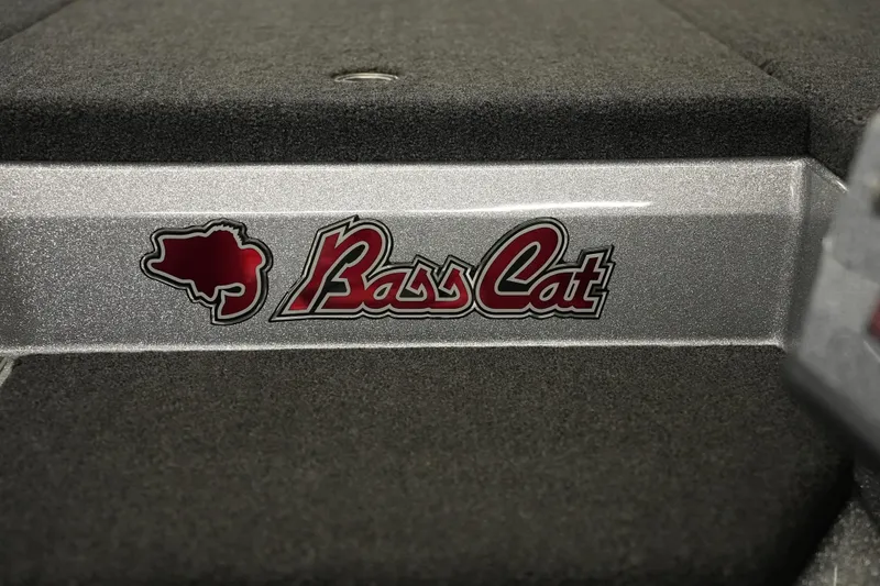 Slide: The Image of 2026 Bass Cat Lynx STS logo on textured boat surface. - 30