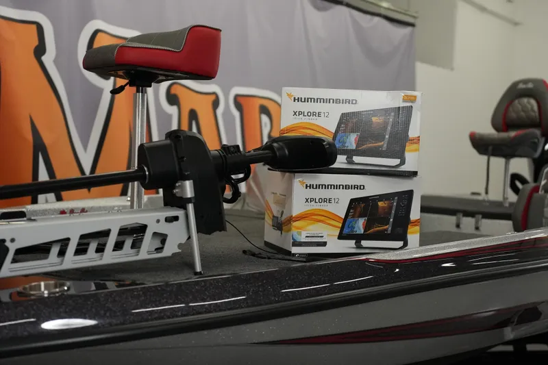 Slide: The Image of 2026 Bass Cat Lynx STS boat with Humminbird Xplore 12 electronics on deck. - 32