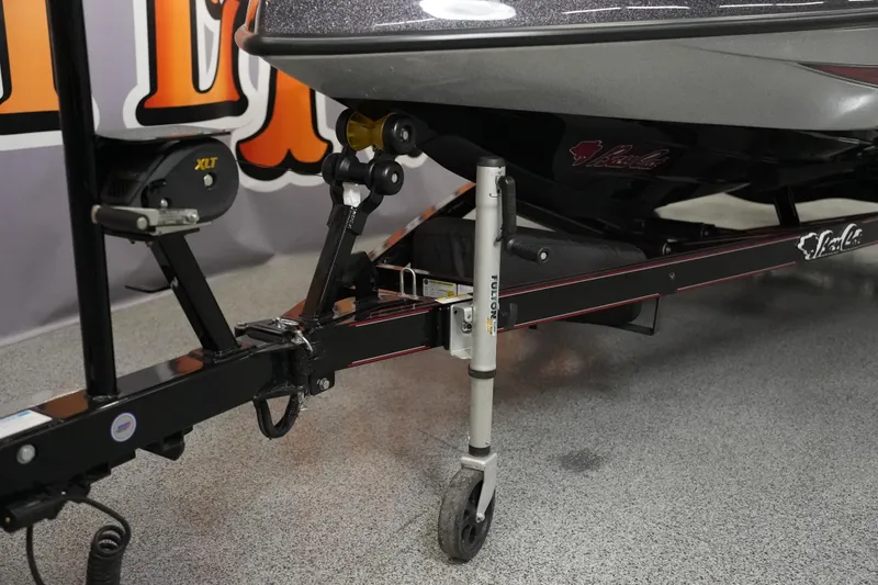 Slide: The Image of 2026 Bass Cat Lynx STS boat trailer with XLT winch and Fulton jack on display. - 9