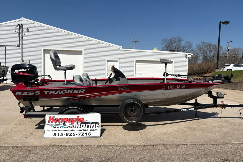 The Image of 2011 Tracker Pro Team 175 TXW bass boat on trailer, parked outside Hennepin Marine. - 1
