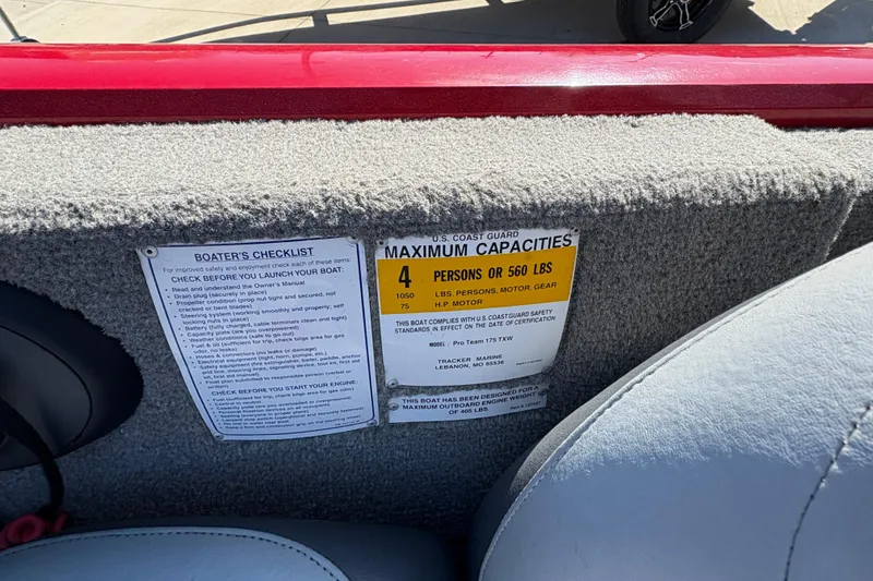 Slide: The Image of 2011 Tracker Pro Team 175 TXW boat capacity label and boater's checklist. - 11