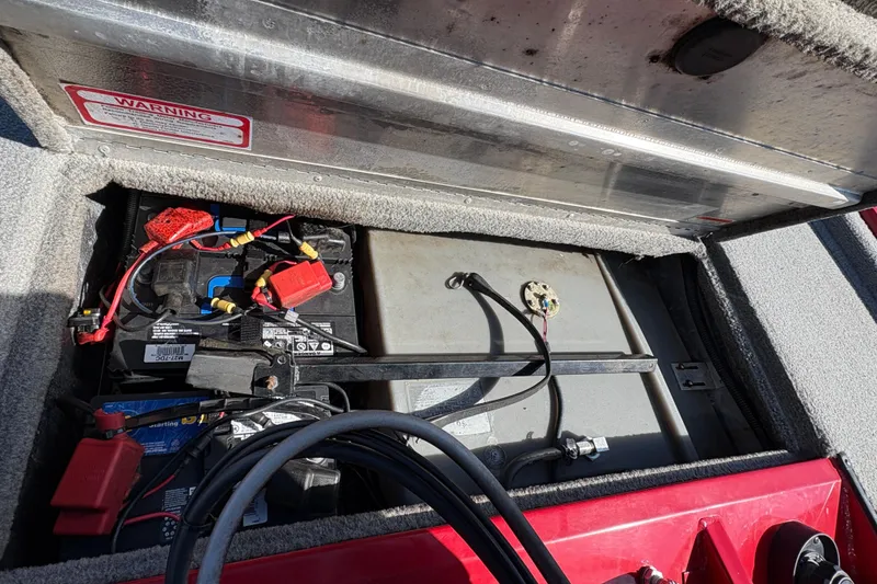 Slide: The Image of 2011 Tracker Pro Team 175 TXW boat battery compartment with wiring and components. - 17