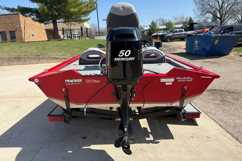 Slide: The Image of 2011 Tracker Pro Team 175 TXW boat with Mercury 50 engine, parked outdoors. - 3