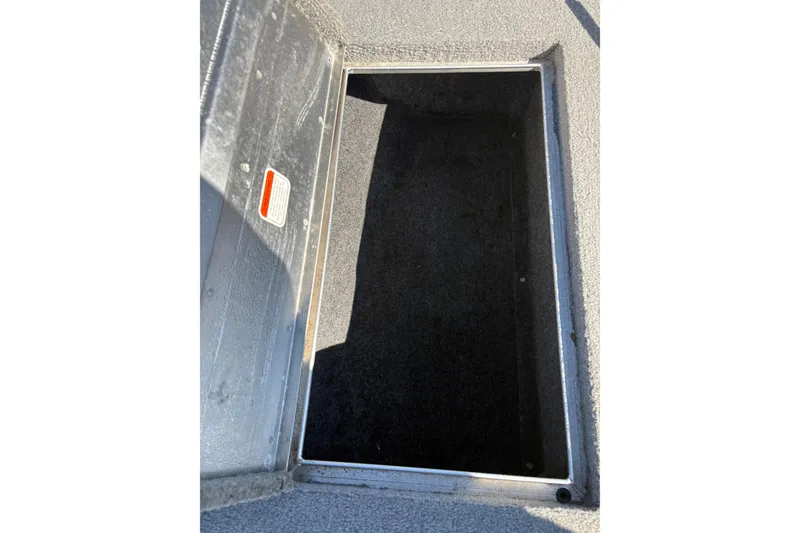 Slide: The Image of Open storage compartment on 2011 Tracker Pro Team 175 TXW boat. - 7