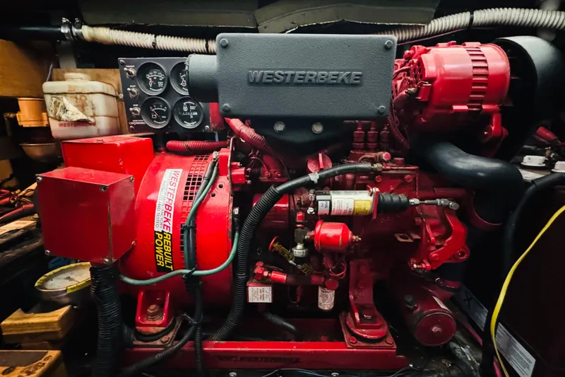 Slide: The Image of Engine room of a 1999 Sea Ray 400 Sedan Bridge with Westerbeke generator. - 104
