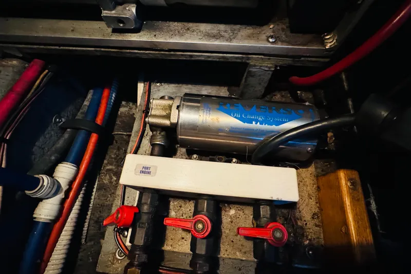 Slide: The Image of Engine compartment of 1999 Sea Ray 400 Sedan Bridge with Reverso oil change system. - 105