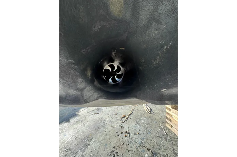 Slide: The Image of Close-up of a 1999 Sea Ray 400 Sedan Bridge thruster tunnel. - 110